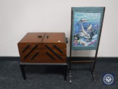 A mid 20th century concertina sewing box and an oak framed screen