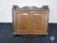 A late Victorian mahogany double door wall cabinet