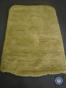 A hand tufted white / yellow rug, 120 cm x 180 cm, rrp £297.00.