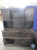 An antique stained oak dresser