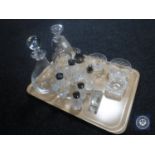 A tray of assorted glass ware, sugar sifter, part cruet set, decanters,