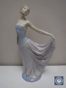 A Lladro figure - lady in flowing dress