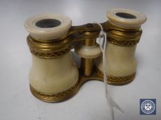 A pair of brass and ivory mounted opera glasses,