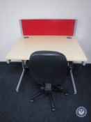 An office work station with divider and swivel office armchair