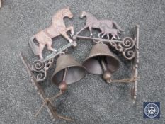 Two cast metal horse wall brackets with bells