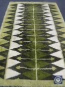 A green woollen rug,
