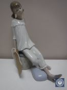 A Lladro figure - girl seated