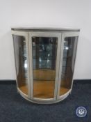 A Nathan painted teak glazed D-shaped display cabinet