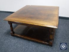 A square oak two-tier coffee table by Titchmarsh & Goodwin