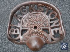A cast metal "Blackstone" tractor seat