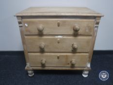 A Victorian pine three drawer chest