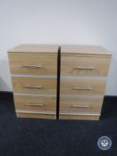 A pair of three drawer bedside chests