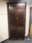 A Georgian mahogany corner cabinet,