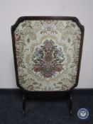 A 20th century mahogany framed floral tapestry table screen