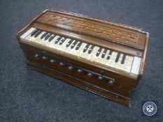 A mid 20th century table top mini organ