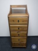 A Ikea pine narrow five drawer chest