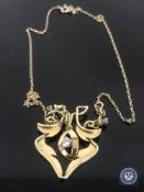 An 18ct gold Art Nouveau style diamond set pendant, the total diamond weight estimated at 0.