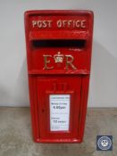 A metal Royal Mail style post box with key