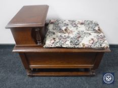 An oak telephone table fitted two drawers with tapestry seat