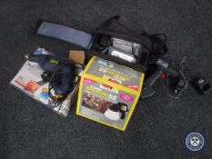 A box containing camcorder in carry bag, two electric drills,