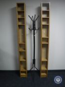 A hat and coat stand and two sets of CD shelves