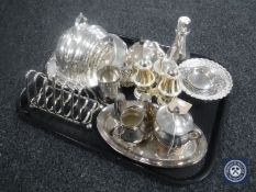 A tray of 20th century plated wares : muffin dish with cover, cruet set, toast rack,