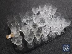 A tray of assorted drinking glasses : cut glass and etched