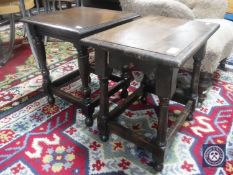 An antique oak stool and similar occasional table