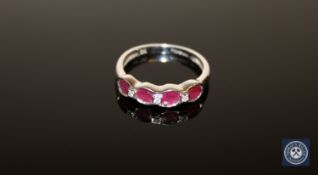 A ruby and diamond half-eternity ring,