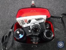 A camera case containing a Pentax KX camera with four lenses CONDITION REPORT: The
