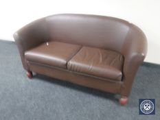 A two seater leather effect settee