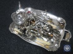 A silver plated twin handled serving tray, assorted flat ware,