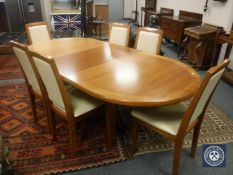 A Skovby contemporary extending dining table (total length 225cm) and six chairs