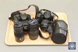 Two cameras (Sony and Canon) together with four lenses : Canon EOS 600 D and Sony N50 Digital SLR,