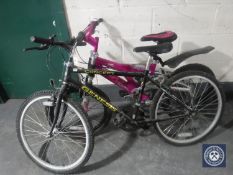 A boy's Genesis concept mountain bike and a Raleigh Urban series dirt style bike
