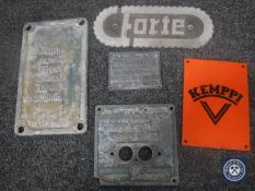 An enamelled Kemppi sign and four cast iron machine plates