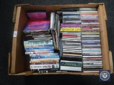 A box of assorted DVD's and CD's a small quantity of vinyl 45 singles