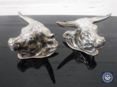 A pair of plated bull's head knife rests