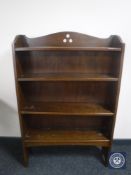 A set of oak Arts & Crafts open bookshelves