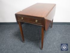 A Victorian Pembroke table fitted a drawer