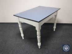 An early 20th century painted pine kitchen table with Formica top