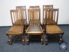A set of four early 20th century oak ladder back chairs