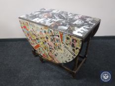 A 20th century barley twist occasional table with decoupage decoration - comic strip and The