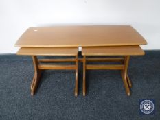 A 20th century teak coffee table fitted two beneath