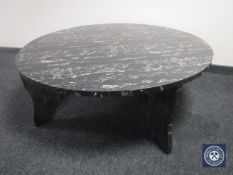 A circular marble effect coffee table
