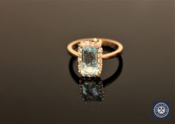 A 14ct yellow gold aquamarine and diamond ring, the rectangular, step-cut,