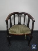A Victorian mahogany bow-backed armchair on claw and ball feet