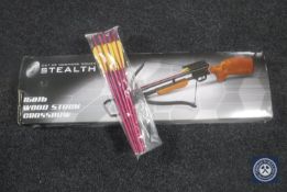 A boxed Stealth Wood Stock 150lb crossbow with arrows