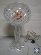 A cut glass table lamp with shade