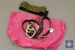 A vintage embroidered sash, leather belt with gilt buckle,